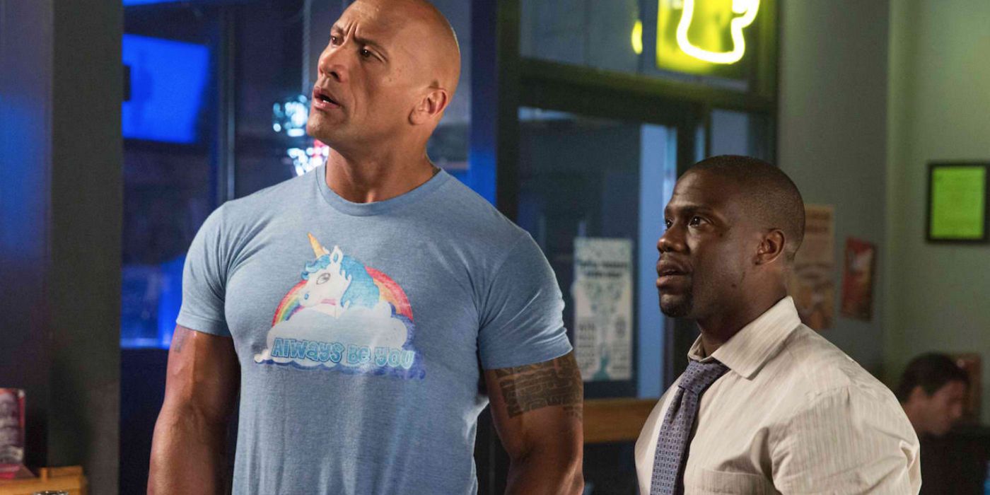 Dwayne Johnson and Kevin Hart look confused in a bar in Central Intelligence
