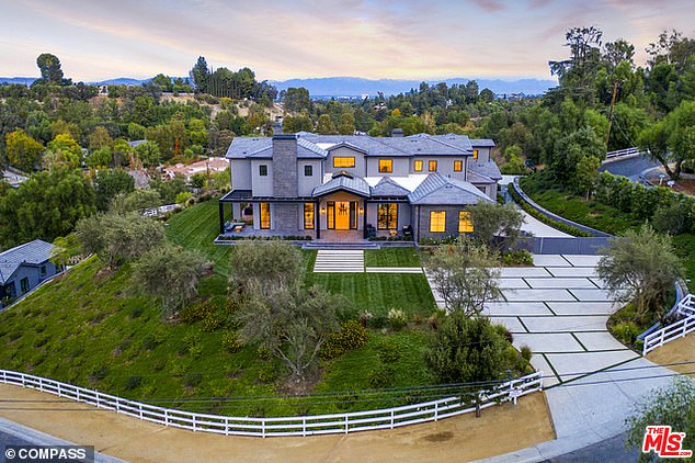 Custom estate: The 12,135 sq ft home boasts 7 bedrooms and 7.5 bathrooms