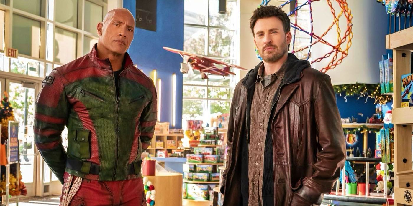 Dwayne Johnson and Chris Evans standing in toy store in Red One movie