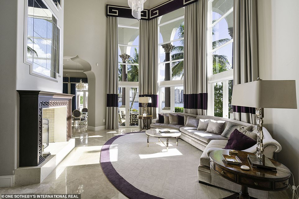 Gorgeous: The property comes with 14 karat gold chandeliers outfitted with Swarovski crystals and floor-to-ceiling windows and a veranda with unparalleled waterfront views