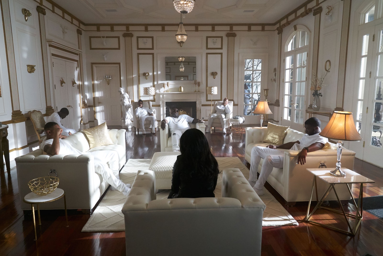 Image may contain Living Room Room Indoors Furniture Couch Human Person Flooring Wood Waiting Room and Lobby