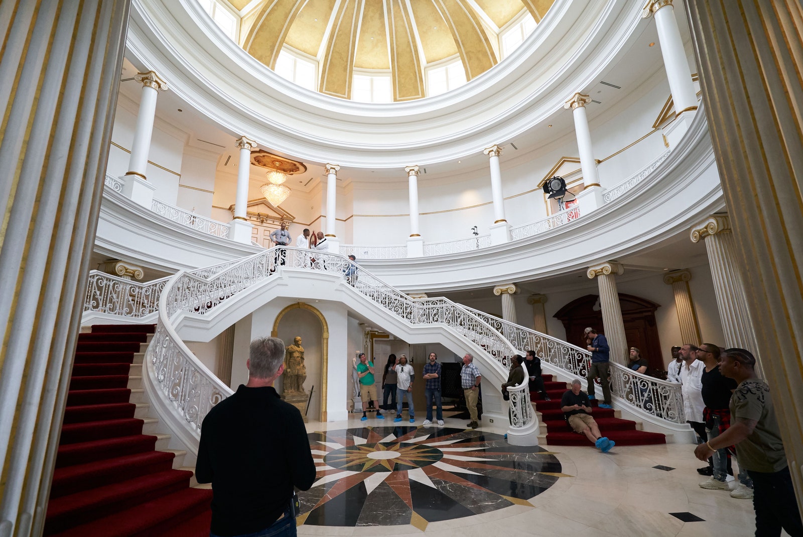 Image may contain Banister Handrail Human Person Flooring Floor Staircase Interior Design Indoors and Lighting