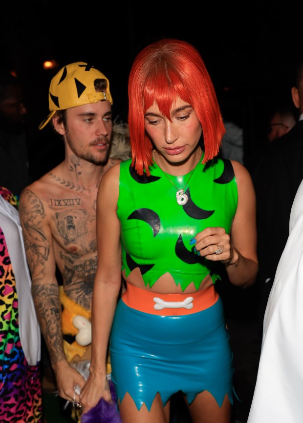 Close Up Of Justin Bieber And Hailey Bieber Cosplaying In Tight Latex Suits As Wilma Flinstone 