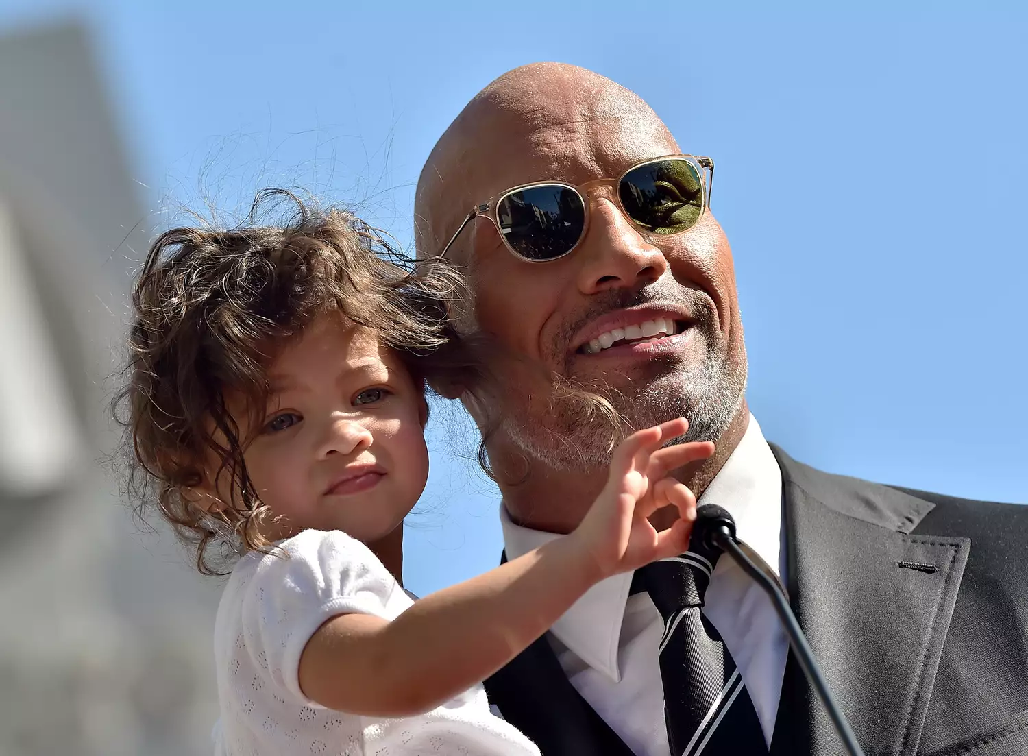 Dwayne Johnson and daughter Jasmine Johnson attend the ceremony honoring Dwayne Johnson with star on the Hollywood Walk of Fame on December 13, 2017 in Hollywood, California