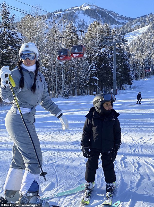 The First Image Of Kim Kardashian Skiing In Crop Top Outfit In Front Of ...